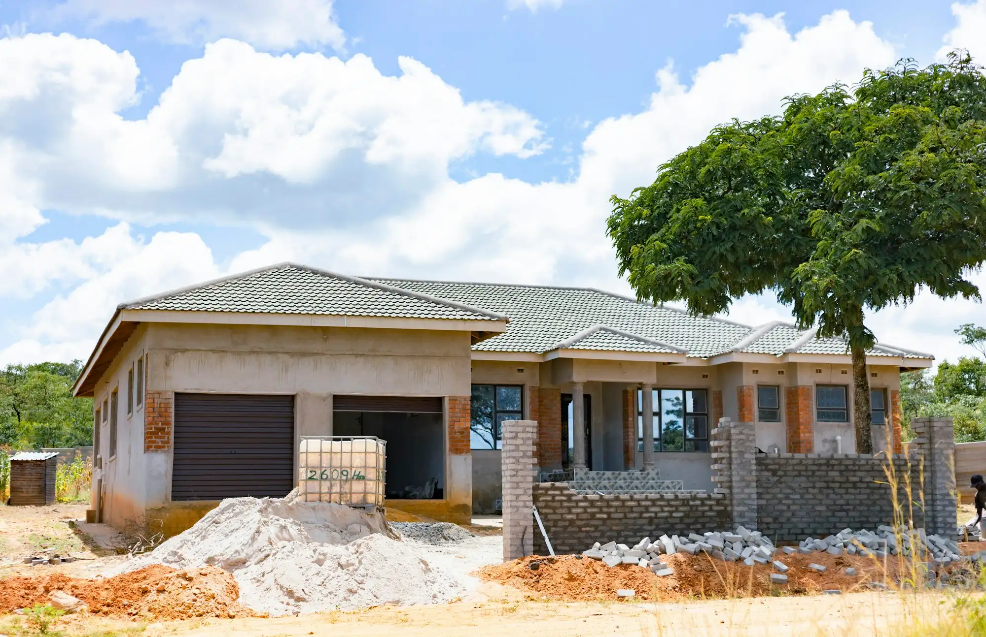 Brick home under construction in a Victorian suburb