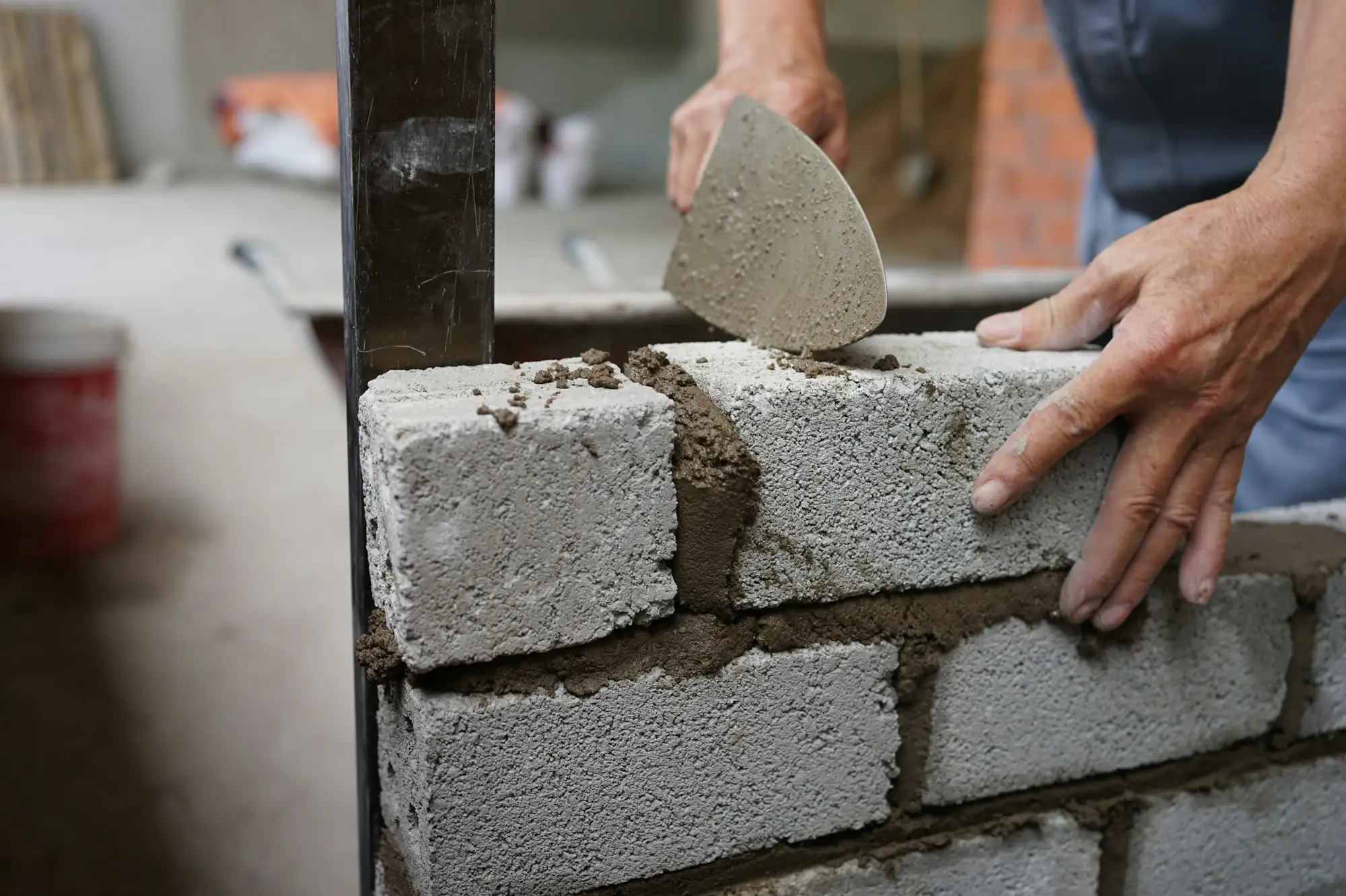 Bricklayer laying a course of bricks on a new Australian home