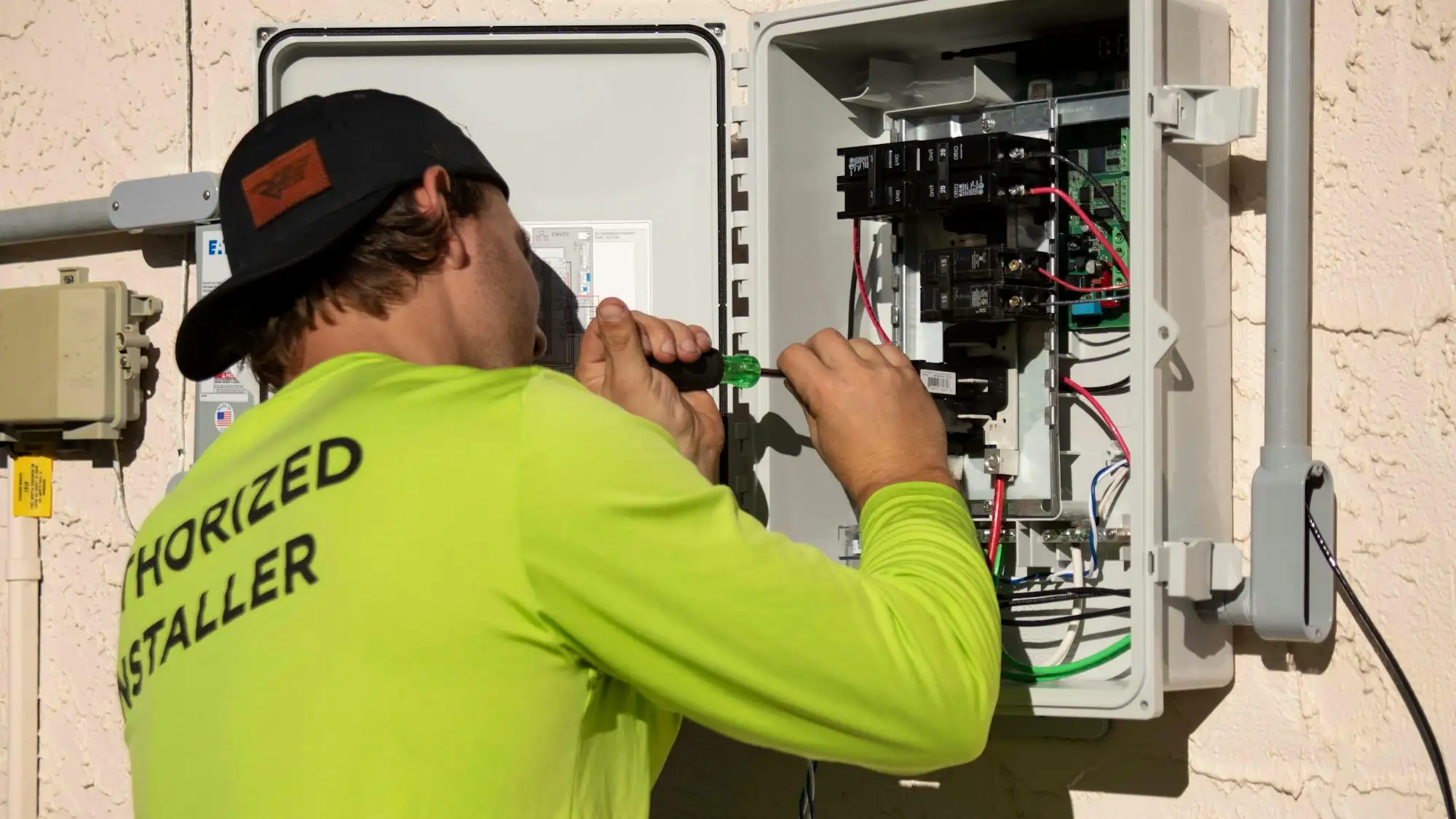 Electrician wiring a new switchboard in an Australian home