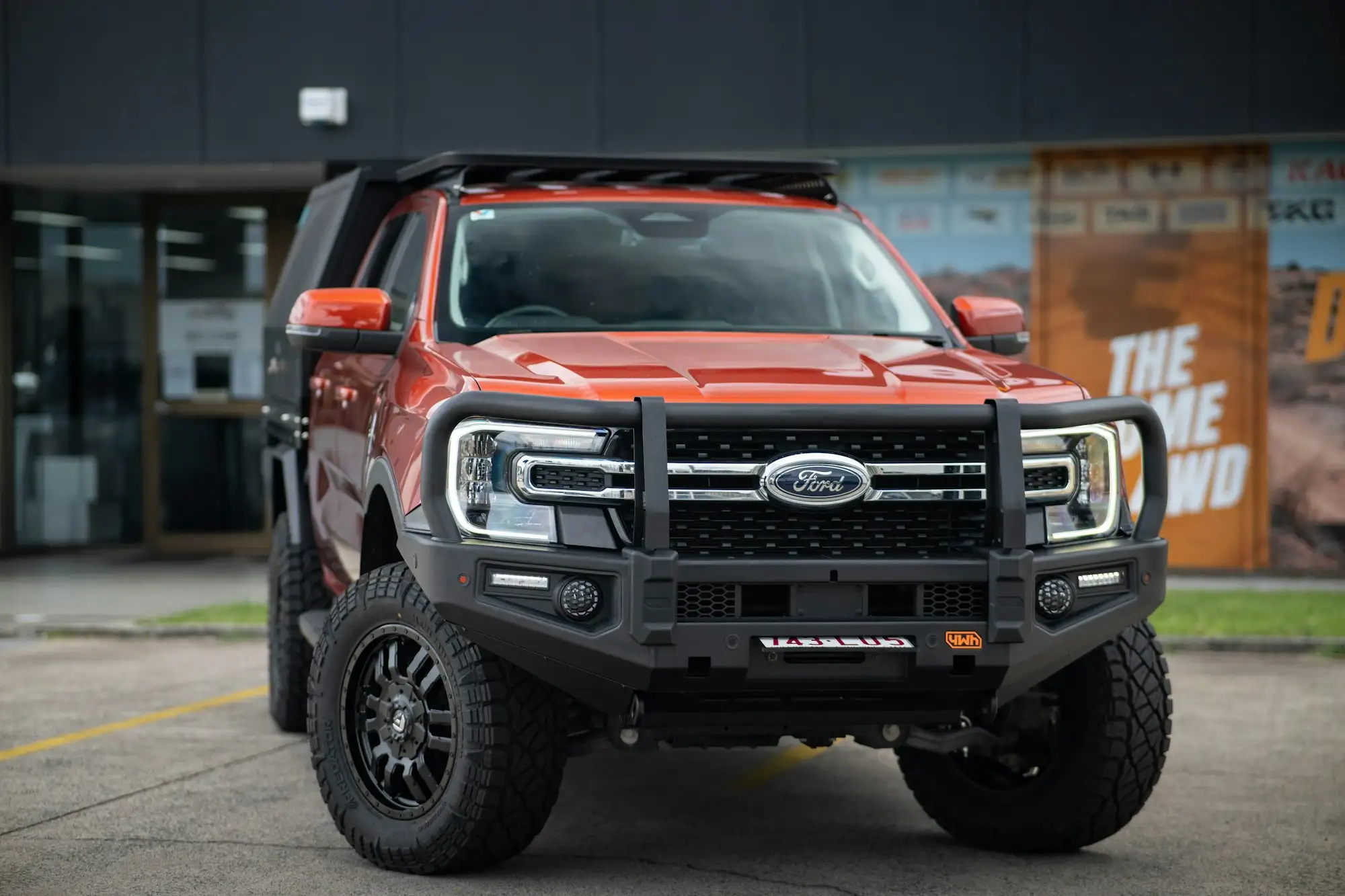 Tradie's ute with a bullbar parked on an Australian work site