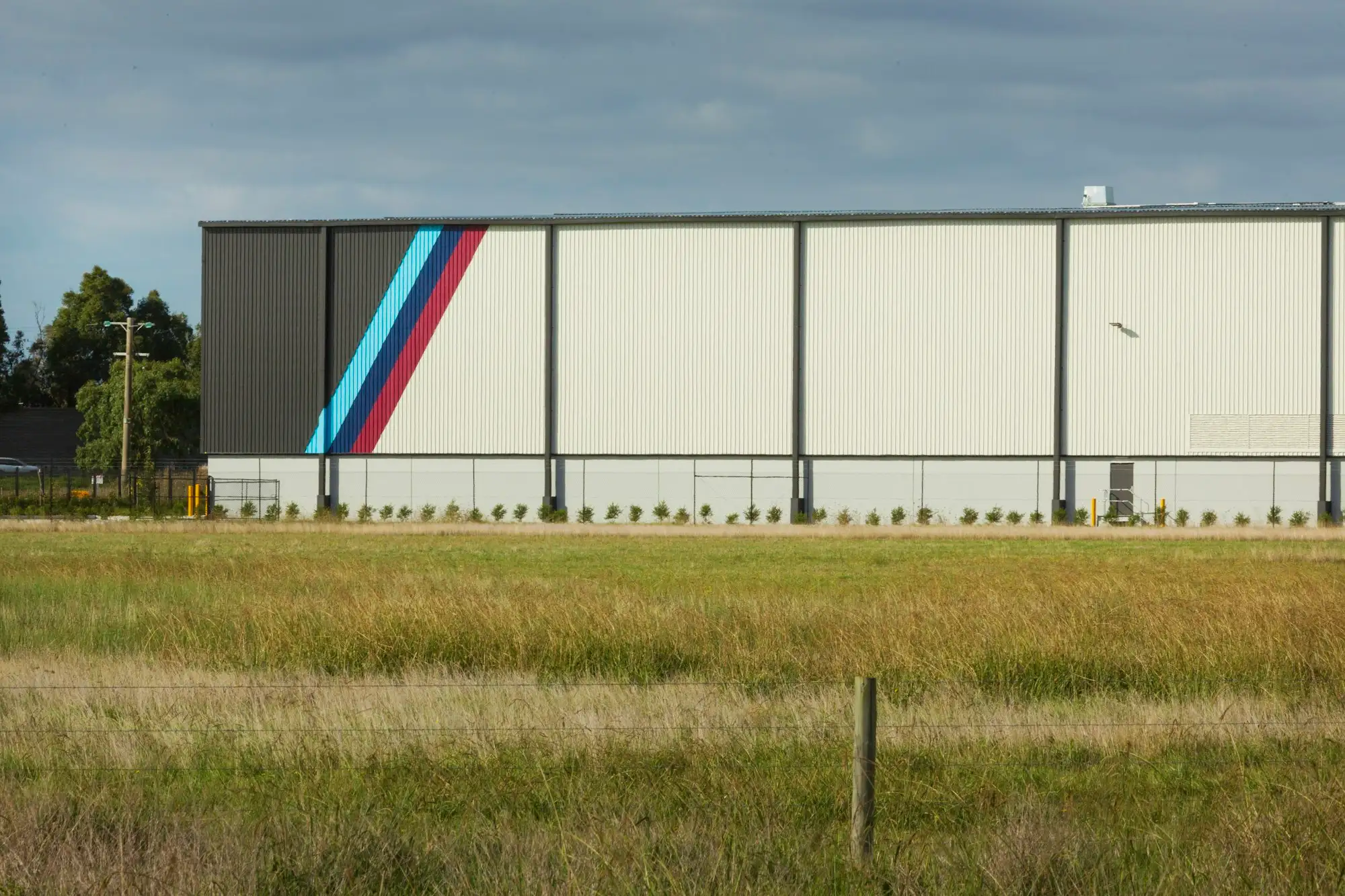 Small steel framed warehouse under construction on an Australian industrial block