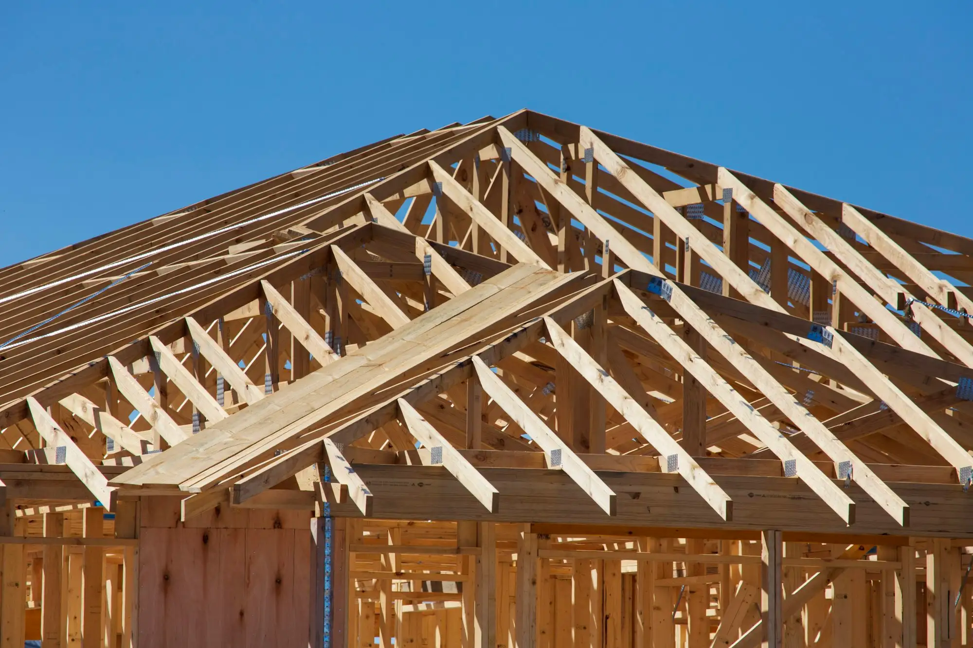 Timber framed house under construction on a residential building site