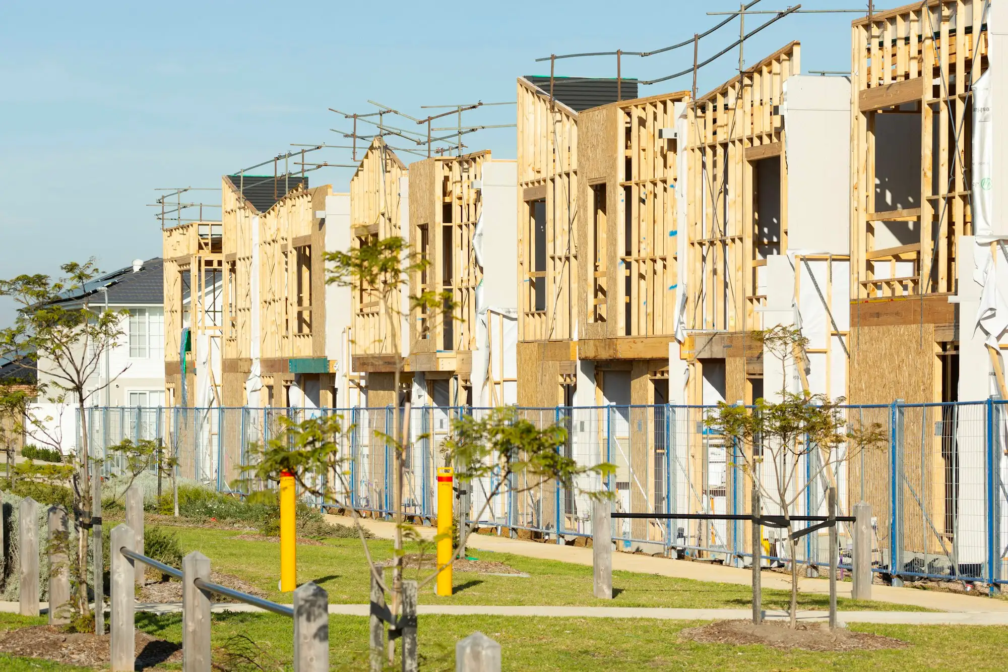 Row of townhouses at frame stage on an Australian estate